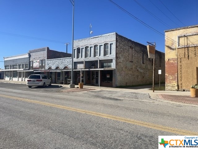 ATTENTION INVESTORS & entrepreneurs, You’ve heard of people owning their own island, well, here’s an opportunity to own part of a TOWN!  Lometa Texas is quite literally the next sleeping town to most likely awaken in the future. While Lampasas is booming, there’s no other direction towards a small Texas town that offers a  deep history and cool historical markers, than Lometa, Texas!. Just 17 minutes northwest of Lampasas and 1.5 Hours from Austin, here’s a chance to bring your vision to fruition and leave a legacy behind. This single intersection of Hwy 281, sees a steady stream of tourists and locals passing through it daily! There are endless ways to capitalize on this specific location,  Food, Gifts, Souvenirs, Art, Antiques, Wine enthusiasts, Live Music, or One’s beautiful car collection on display for thousands to enjoy! These three historical buildings need that someone with the financial wherewithal and a creative vision to create a destination location!! The old saying, “Build it and they will come”. We’ve all seen it happen! It just takes one to attract other like-minded creators.  On this main interaction, there’s an opportunity to own more than just these three buildings, heck, allow me to help you buy the whole block- or two! The current owner is open to creative financing as well. Give me a call today!