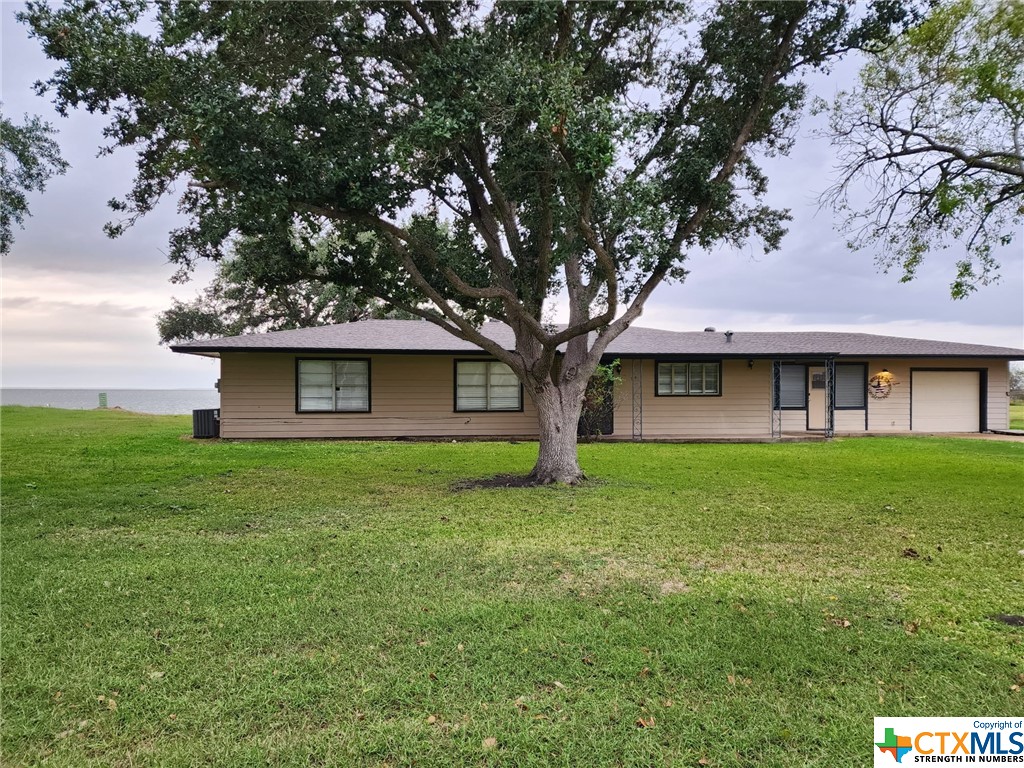 If picturesque Texas coastal sunsets are your thing, you’ve found your slice of heaven on Texas avenue.  Whether you’re looking for a residence or vacation home, here in the quaint coastal town of Point Comfort sits this gem with personal water and fishing access. This is a 3 bedroom 1.5 bath with 2 separate living spaces and a 1 car garage on .78 acres. There is a back patio space perfect for family gatherings or a leisurely sit to take in the coastal breeze and gentle sound of the waves.