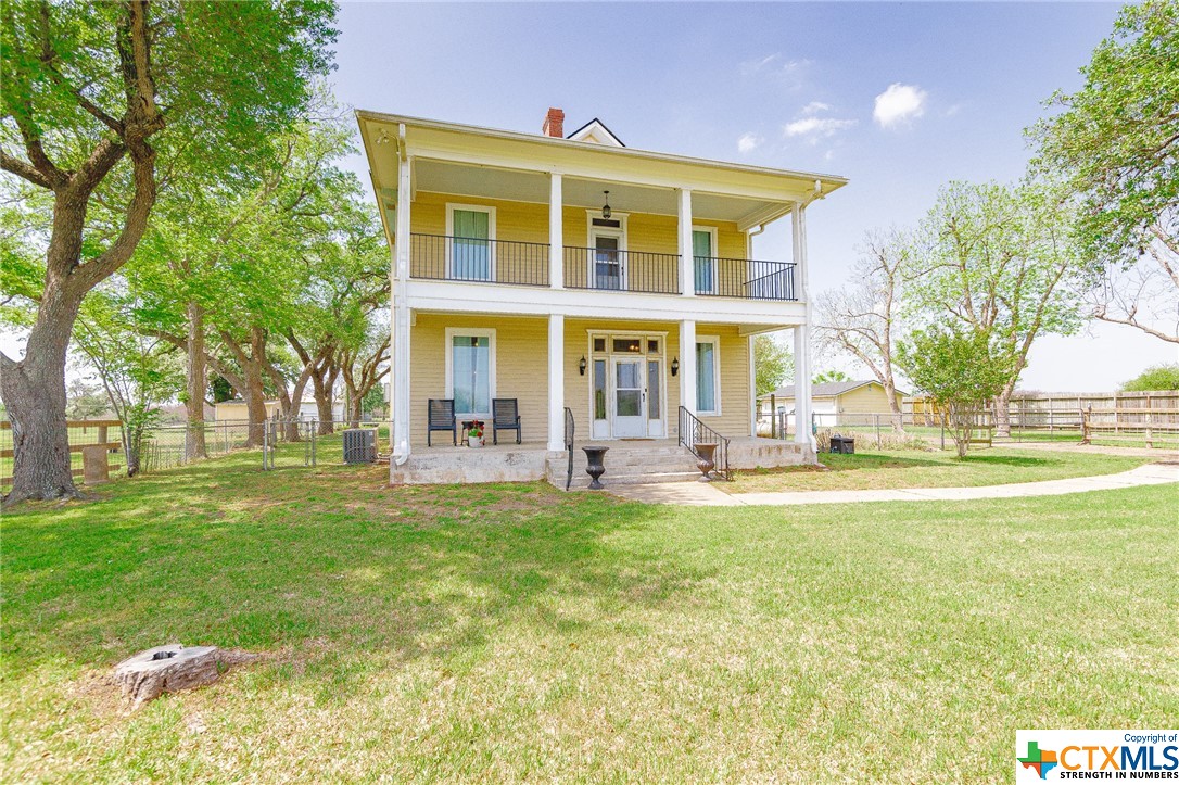 Discover the perfect blend of town and country living at 5507 N Main St, Victoria, TX. This 3 bed, 2 bath home on 1.33 acres features timeless original hardwood floors, a spacious 3 car garage and a rustic barn. Embrace the unique atmosphere with a darling front porch, second story balcony, and detached deck, providing scenic views. Inside you will find tasteful upgrades including granite countertops, custom cabinetry, and stainless steel appliances. There is room for entertaining with multiple dining and living areas. Notably, a rare feature is the partial basement, adding an extra layer of character to this exceptional home. Schedule your showing today!