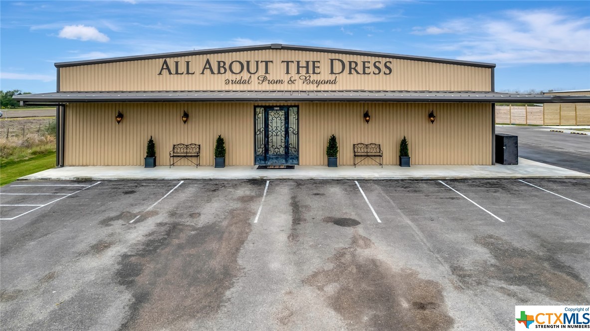 This prime commercial property spans right over 4 acres, boasting an impressive 475 feet+\- of highway road frontage. Comprising two buildings, the first encompasses 7,500 square feet and features versatile spaces, including a retail area, offices, storage/warehouse space, and a convenient apartment/living area. The second building, spanning 6,000 square feet, is thoughtfully designed with 8 dressing rooms, 2 public restrooms, an office, and a finished office/storage area. Currently serving as a prestigious bridal and prom gown retail store, the property holds immense potential for various retail ventures or even a local venue. Its strategic location and well-structured buildings make it an ideal investment for entrepreneurs seeking a dynamic commercial space with numerous possibilities for expansion and diversification.