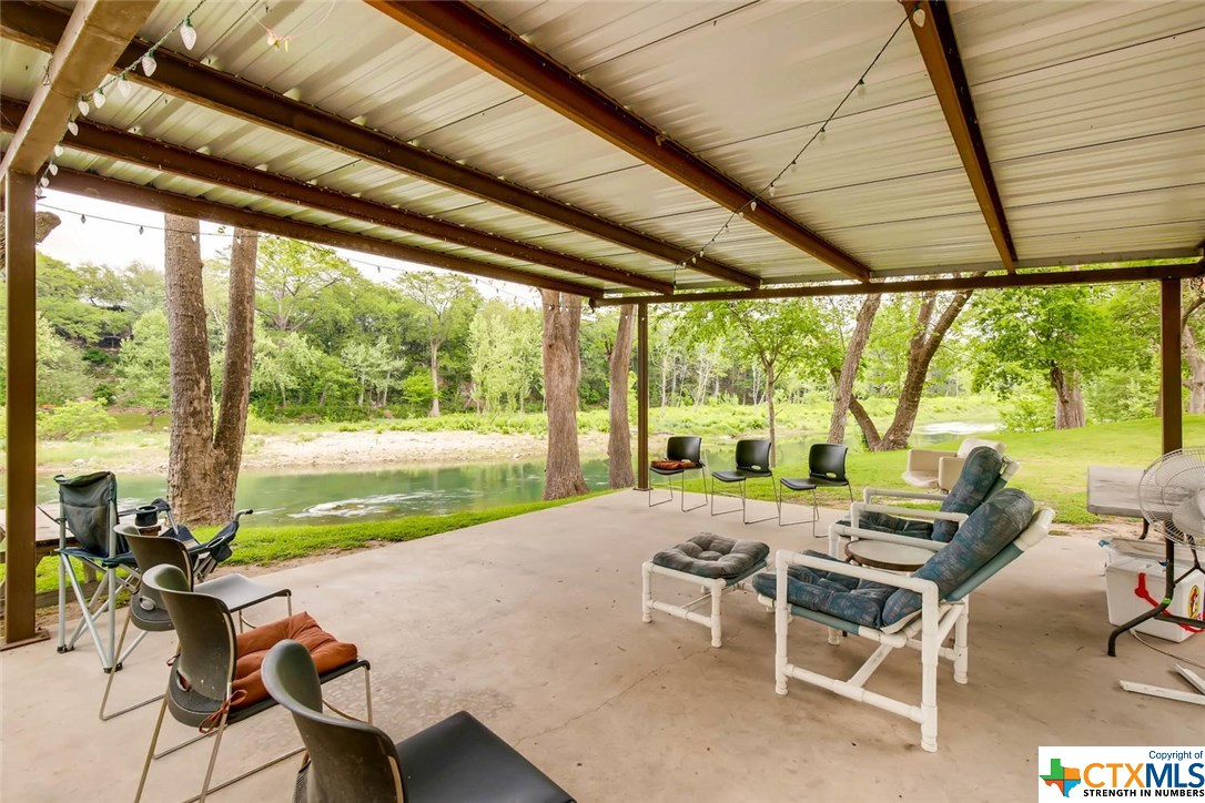 Covered patio on the riverfront section of the property.