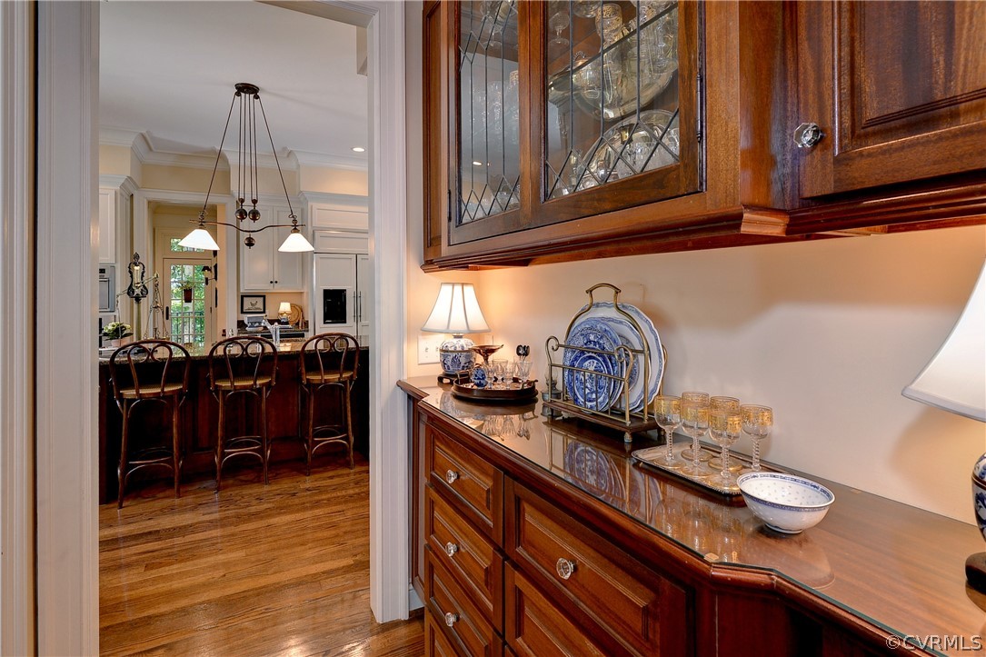 The butler's pantry is located between the kitchen and dining room and has extra storage space.