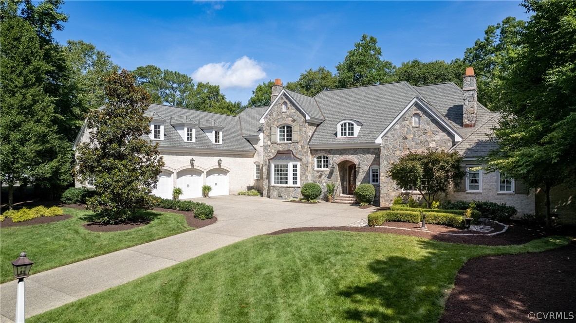 Custom-built by Butch Palmer, this timeless home on a private lane has 7,445 square feet, with four bedrooms, four full and four half baths and an oversized three-car garage.