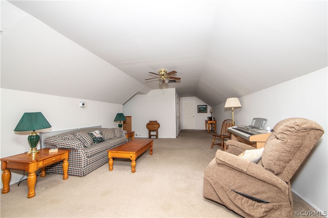 The bonus room on the second level is spacious and offers carpet and a ceiling fan.