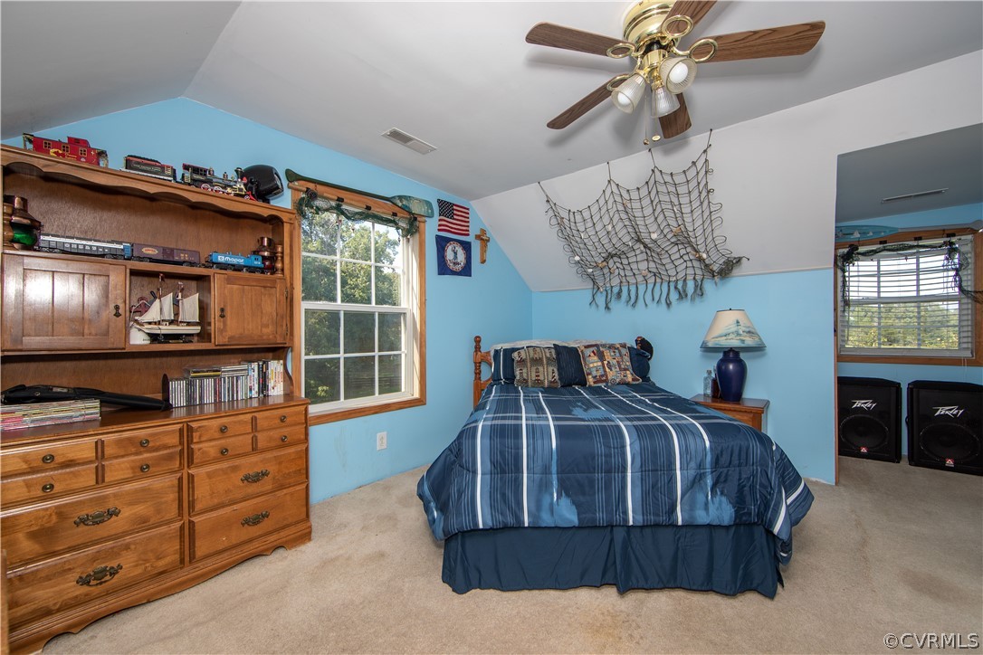 Bedroom six is on the second level and offers carpet, and a ceiling fan.