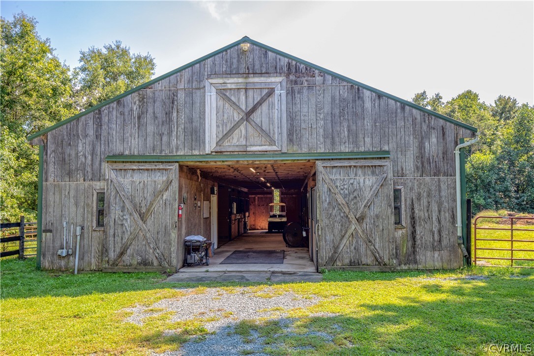 The barn is well-equipped w/lighting and 200 amp service (set up w/disconnect for aux generator).