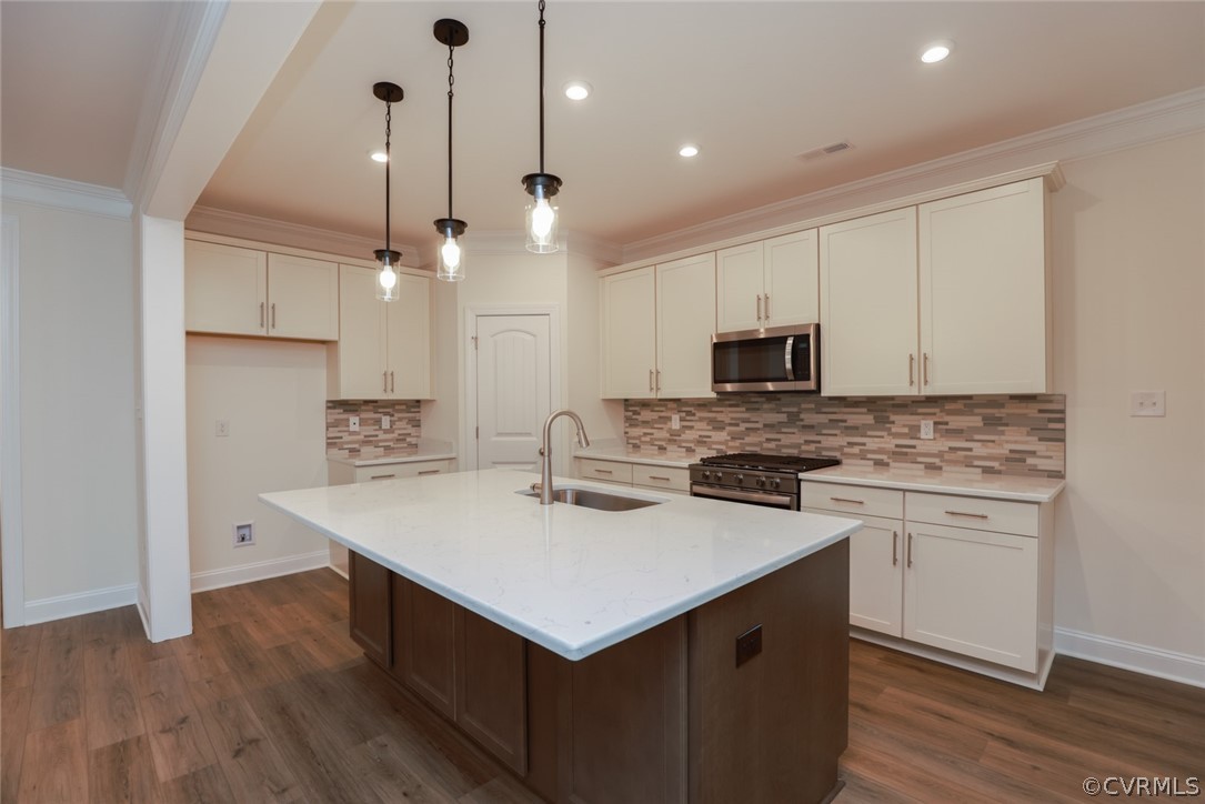 Professional photos have been added. Kitchen featuring quartz counters, tile backsplash, 42” cabinets, SS appls, gas cooking, and island is open to the bright and cheery breakfast nook. Family room w/ corner gas FP looks out onto the covered porch.