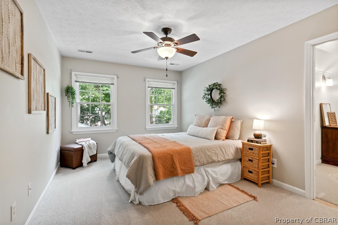 Another roomy bedroom with brand new carpeting and of course, another ceiling fan.