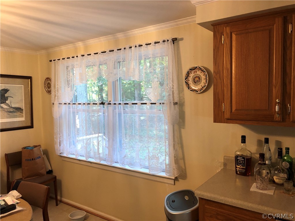 Spacious Eat-In Kitchen with Double Windows for View of Rear Wooded Yard. Opens directly to the Living Room for an even larger feel.