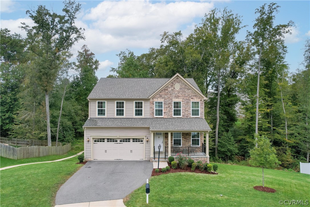 Welcome home to this beautiful stone and vinyl home on a private cul-de -sac lot.