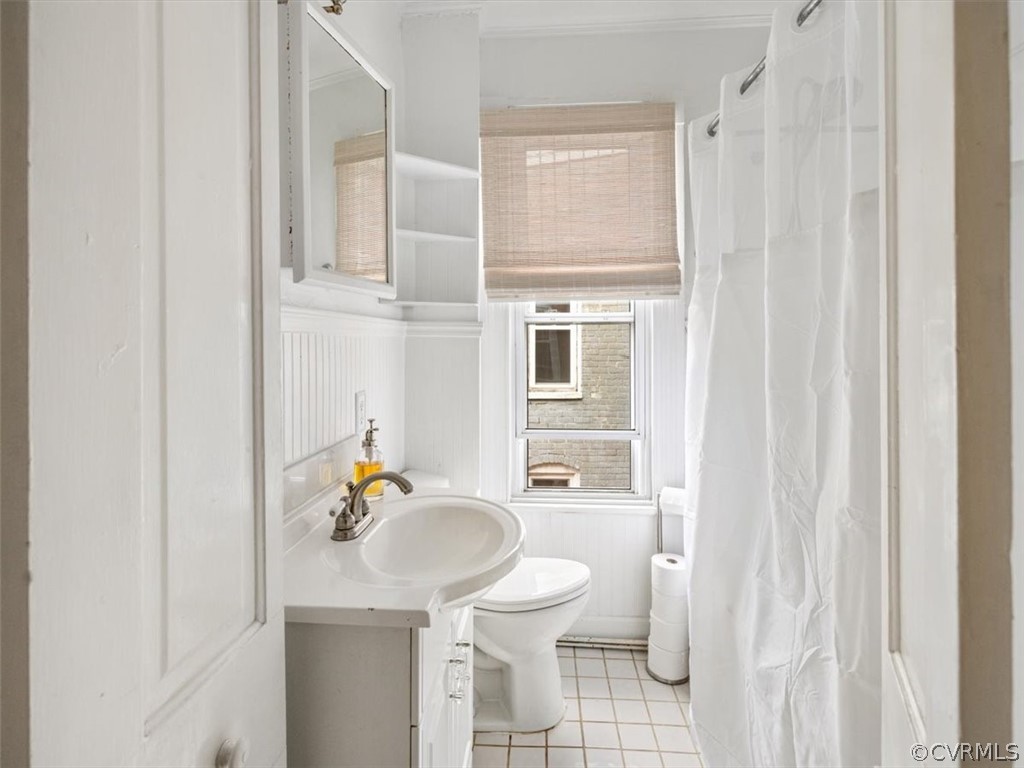 Full Bathroom on upper level with tub/shower combo and tile floors.