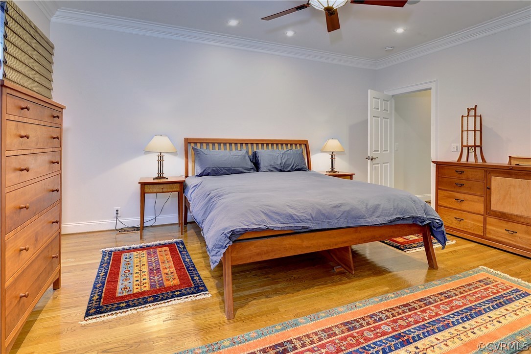 The first-floor primary bedroom offers hardwood floors, an updated en suite bath and a large walk-in closet.