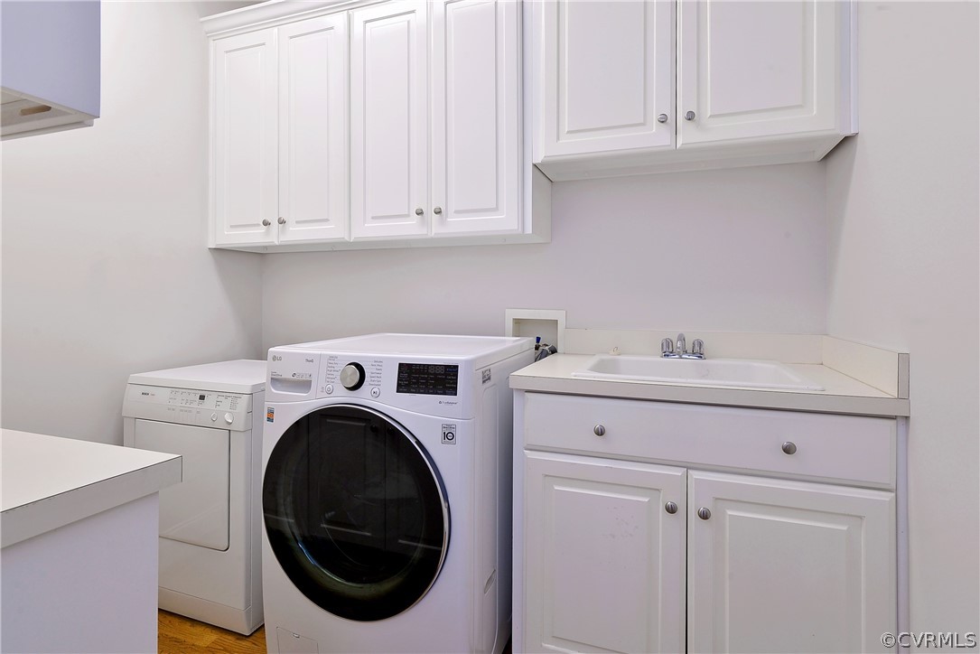 The first-floor laundry has a utility sink and storage space.