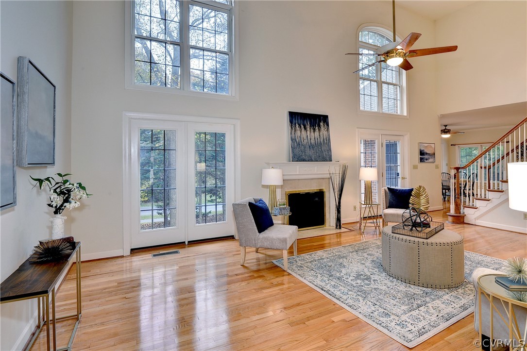 The warm, inviting great room features a cathedral ceiling, hardwood floors, and gas fireplace.