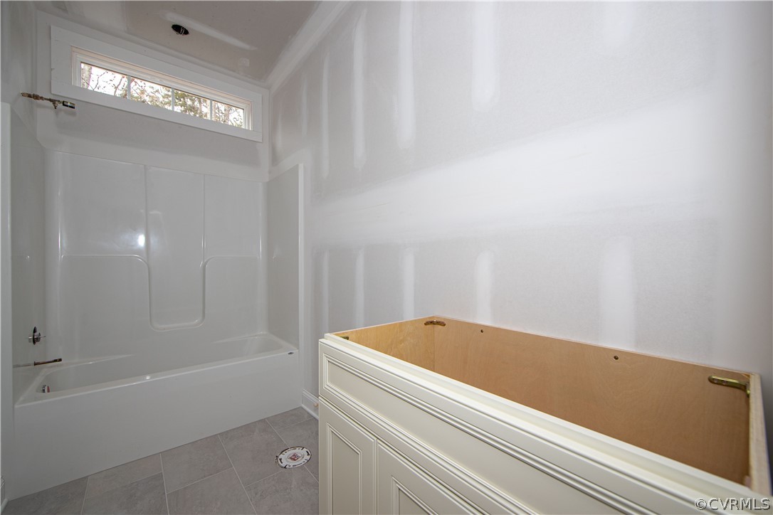 Hall Bath with ceramic tile floor and transome window.