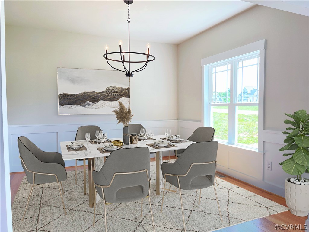 Virtually Staged Great Room open to Informal Dining Room.