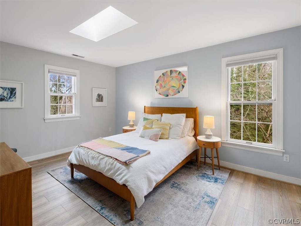 Massive primary bedroom on 2nd floor with skylight with operable shade & new LVT flooring.