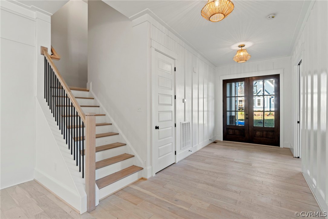 Foyer Entry and Staircase to 2nd Floor. *Photos of Previous Model Home. Optional Features and Finishes may be demonstrated.*