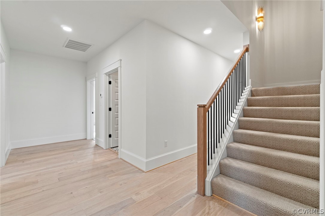 2nd Floor Hallway with Staircase to 3rd Floor. *Photos of Previous Model Home. Optional Features and Finishes may be demonstrated.*