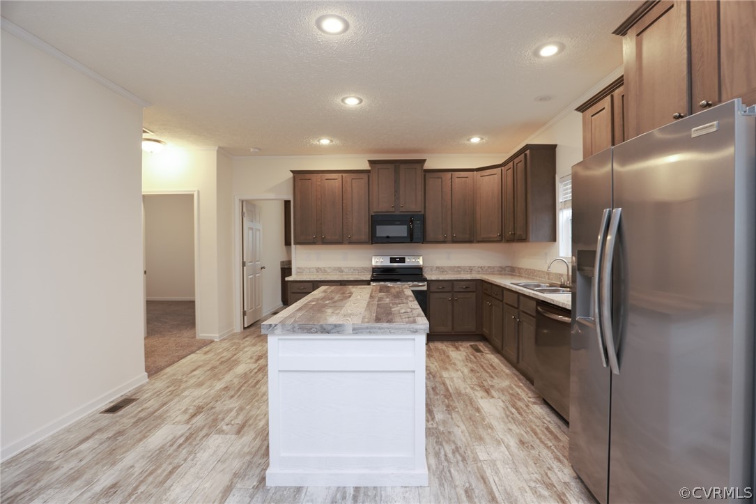 Kitchen with Large Island and Stainless Appliances