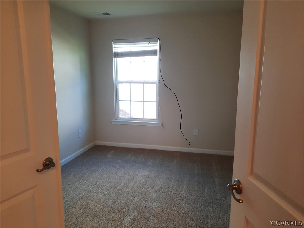Office/Dining Rm, or put a closet in it and it will be a 4th bedroom. New Carpet and Paint.