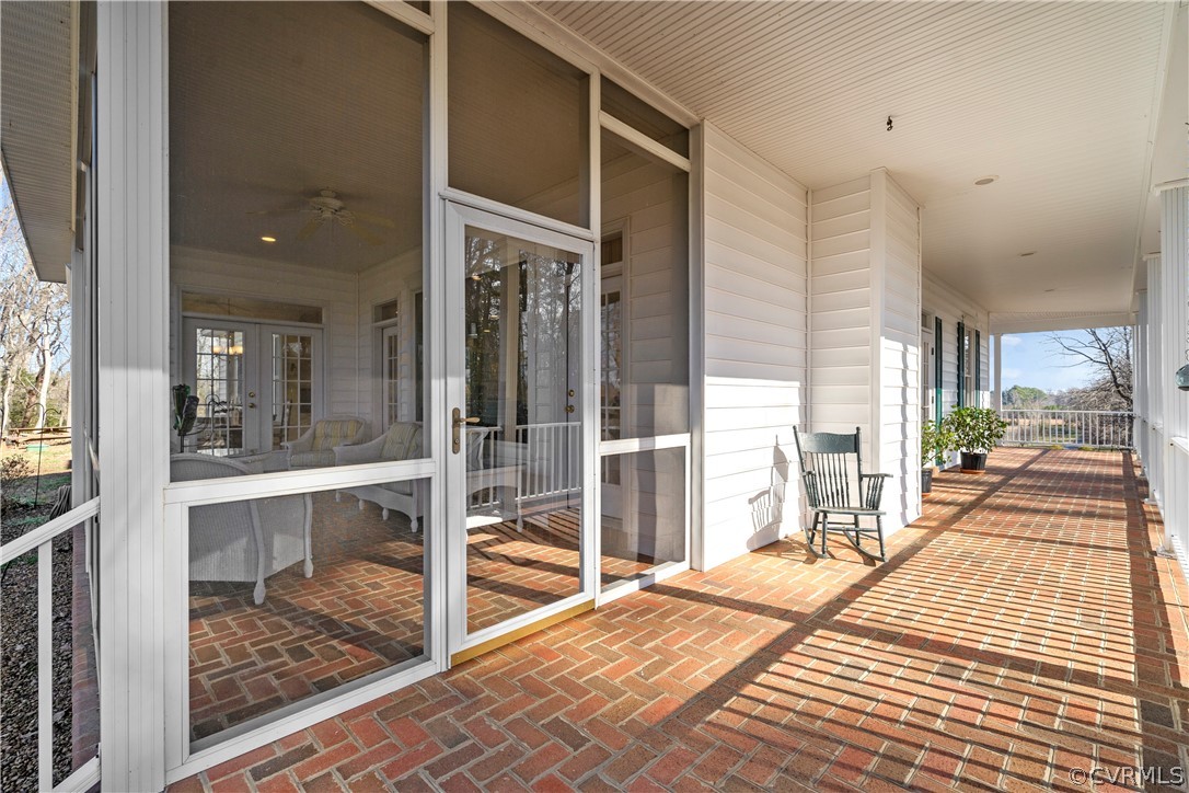 Wide wrap-around porch off of screened porch