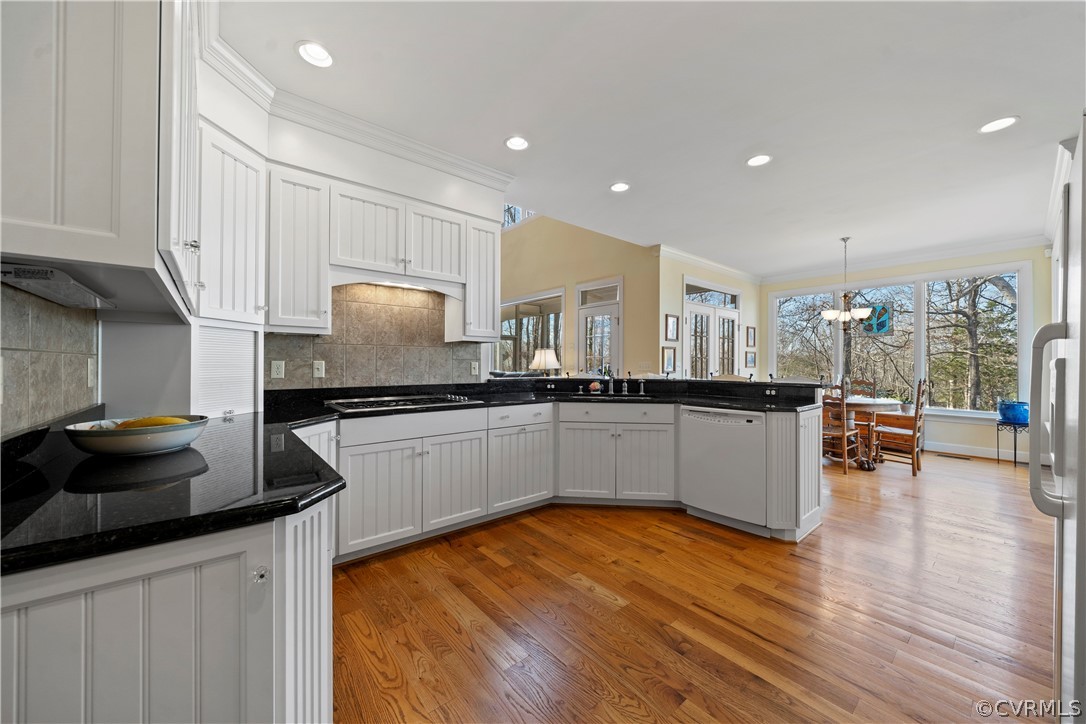 Kitchen with granite counters and gas cooking
