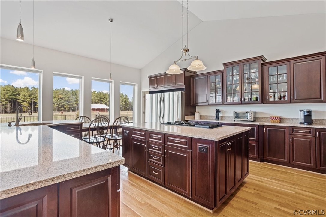 This gourmet/chef kitchen is already for entertaining!  So much space to mingle!  Lots of storage and granite counter space to work with!  Plus, enjoy the built in table area and gorgeous country scenery!  Love the glass accent cabinets, such a luxurious touch!