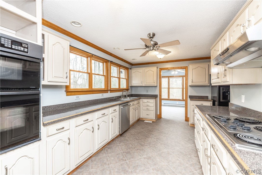 Well equipped kitchen with built microwave and oven-ceramic tile floor