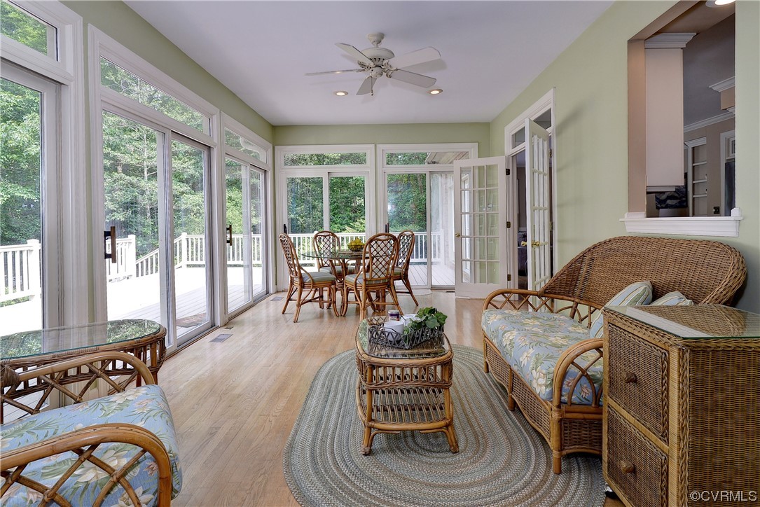 The spacious sunroom is filled with windows and tons of natural light and provides the perfect venue for informal dining.