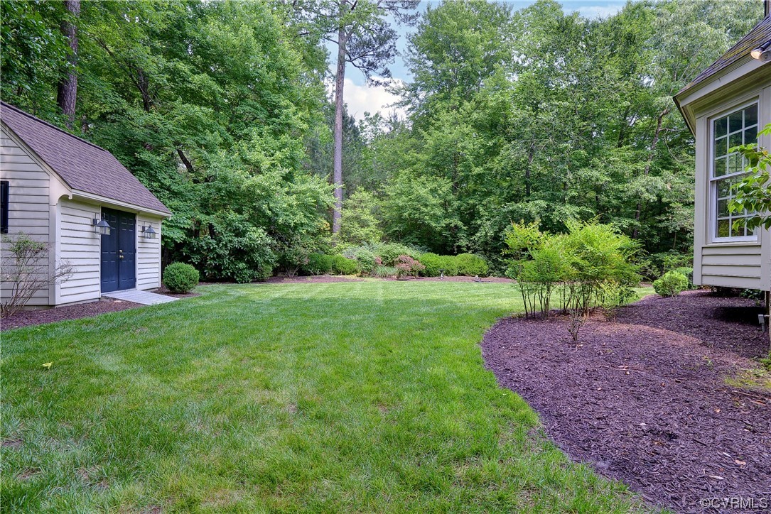 Conveniently located on a quiet street, this perfect-sized all brick home backs to wooded privacy and offers fabulous floorplan on a beautiful lot.