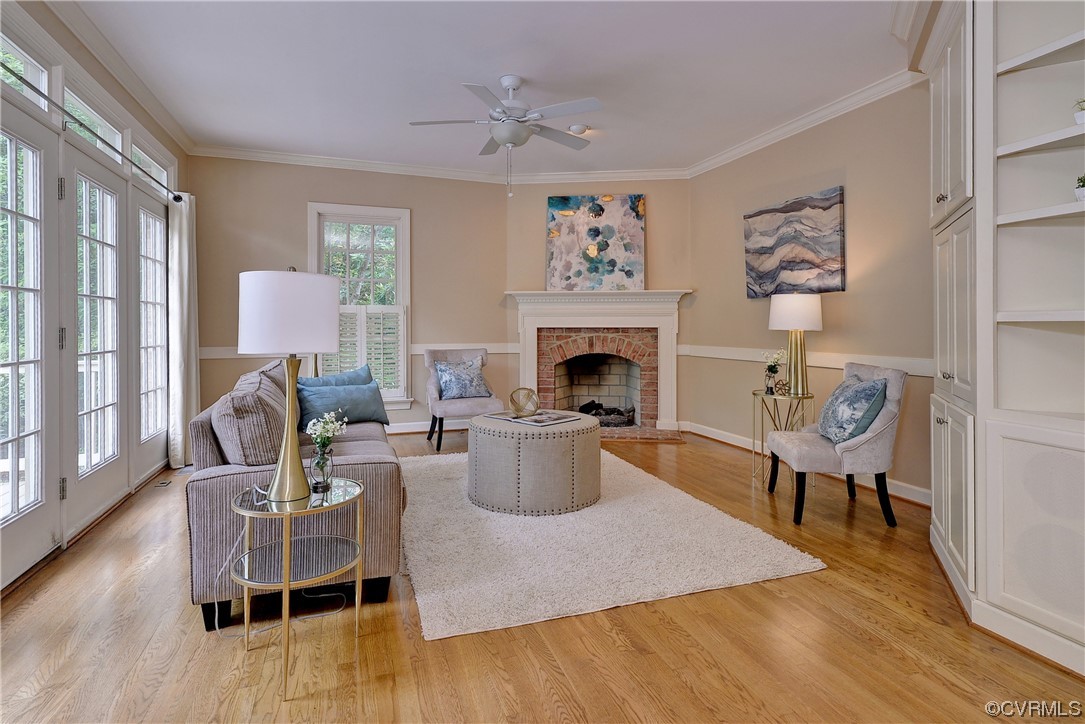 The family room features built-ins, hardwood floors and a gas fireplace.