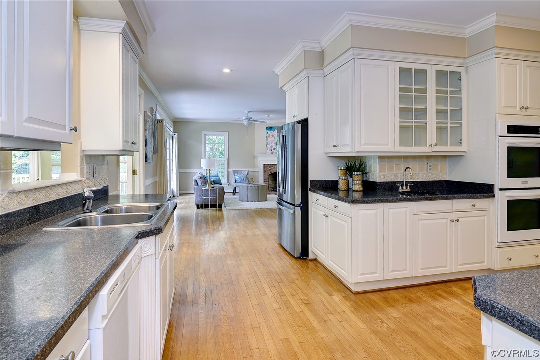 The kitchen offers a second prep sink and abundant cabinetry.