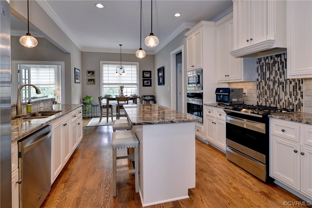 Crisp white cabinets and stainless appliances make this kitchen shine.