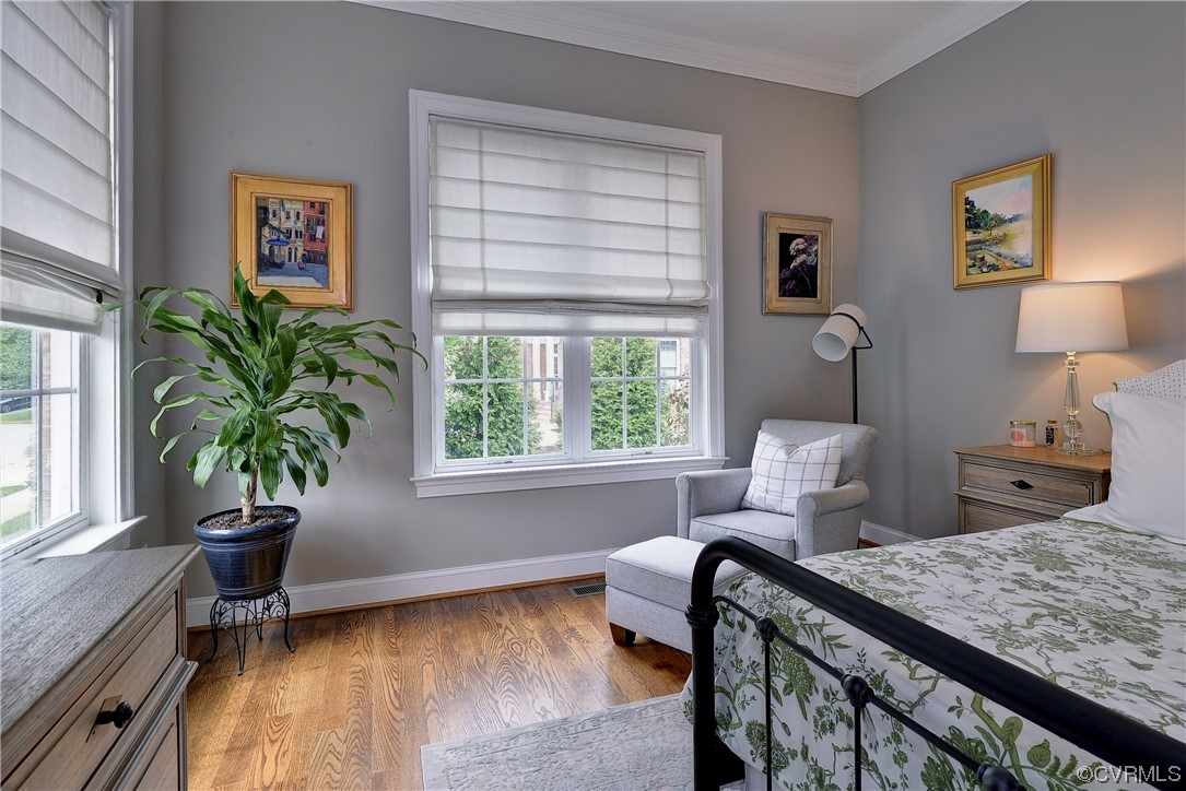 The first-floor primary bedroom is spacious and overlooks the backyard.