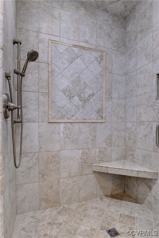 The tiled step-in shower has two separate shower heads for a spa-like experience.