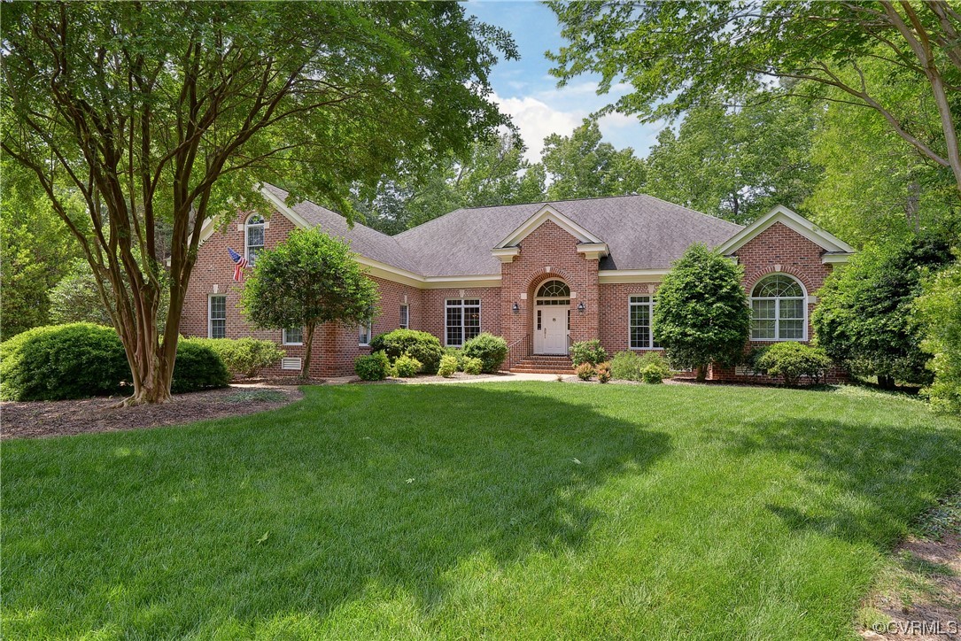 Simply extraordinary Governor's Land home on a private wooded lot that backs to the James River!