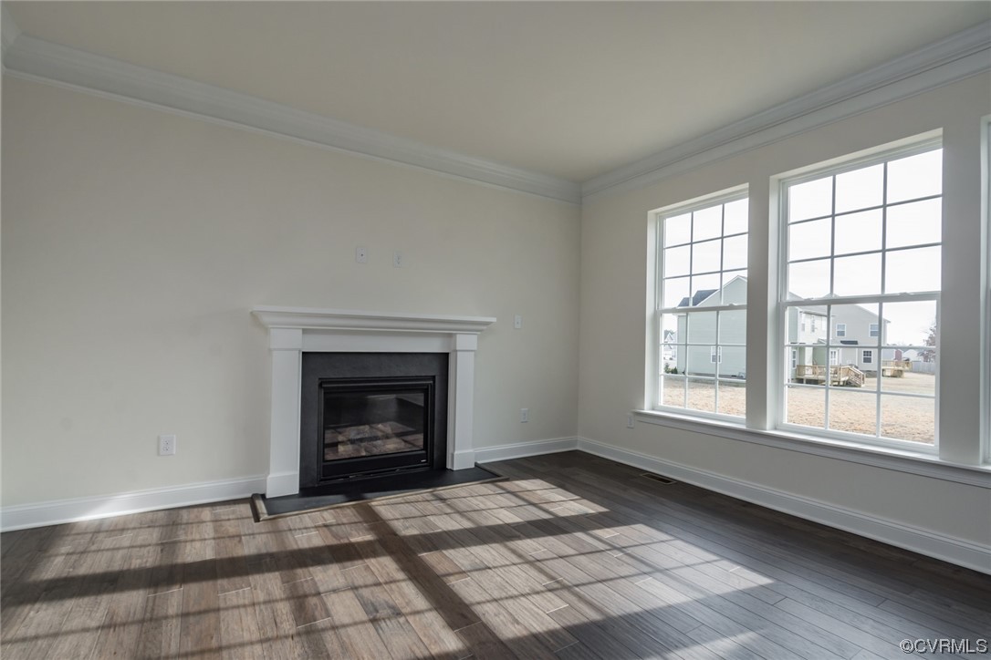 Photo represents the plan, not the actual home. Design selections may vary. Relax in the spacious family room with a gas fireplace and ceiling fan. Convenient powder room completes the first floor.