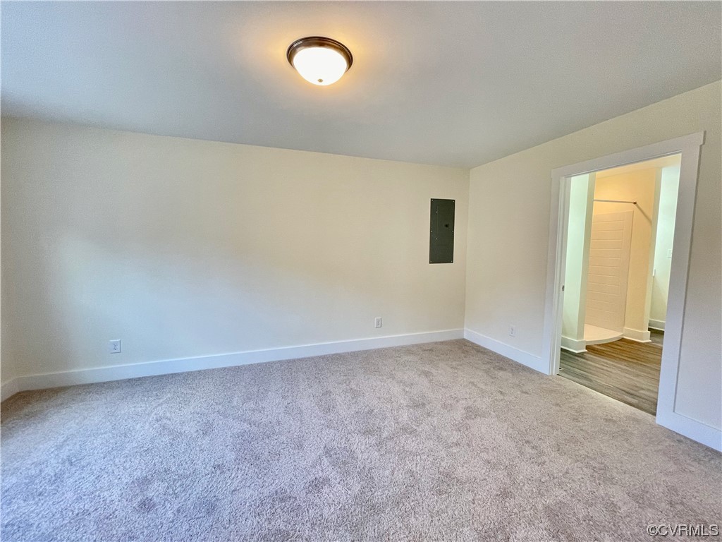 primary first floor bedroom with carpet