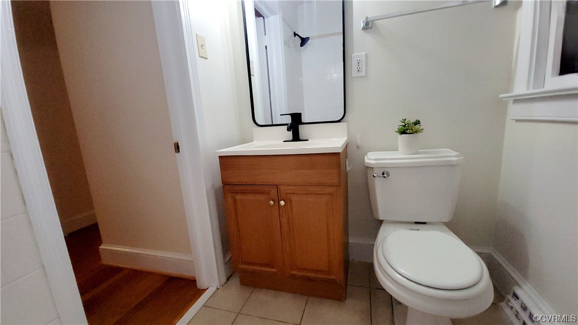 Full bathroom with toilet, shower / washtub combination, tile flooring, and vanity