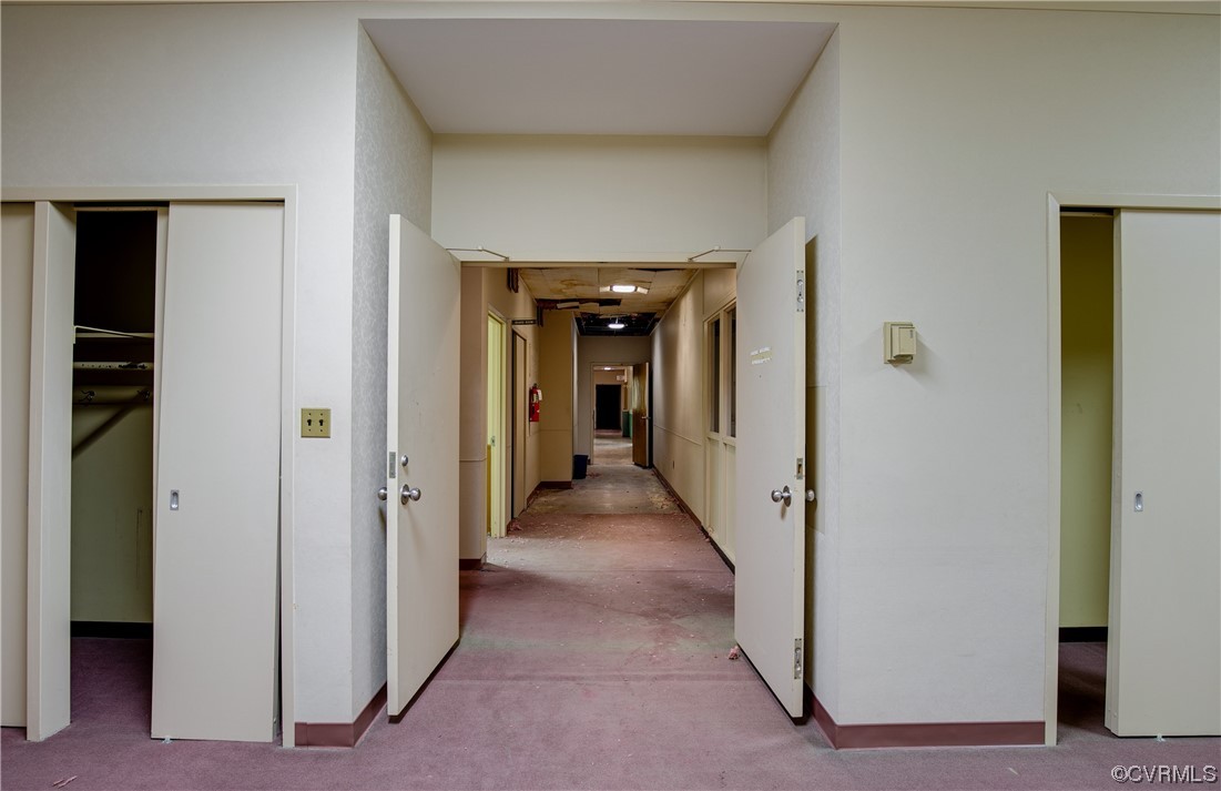 Hallway with light carpet