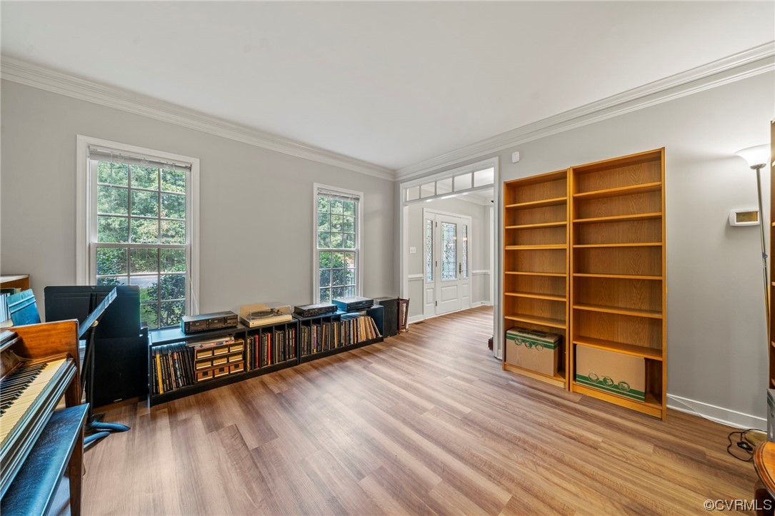 Hardwood floored office with crown molding