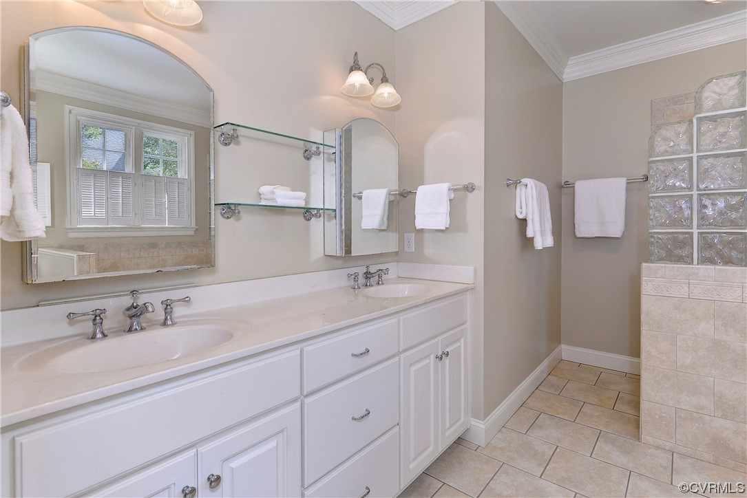 The primary bathroom has a dual sink vanity, jetted tub, and step-in shower.