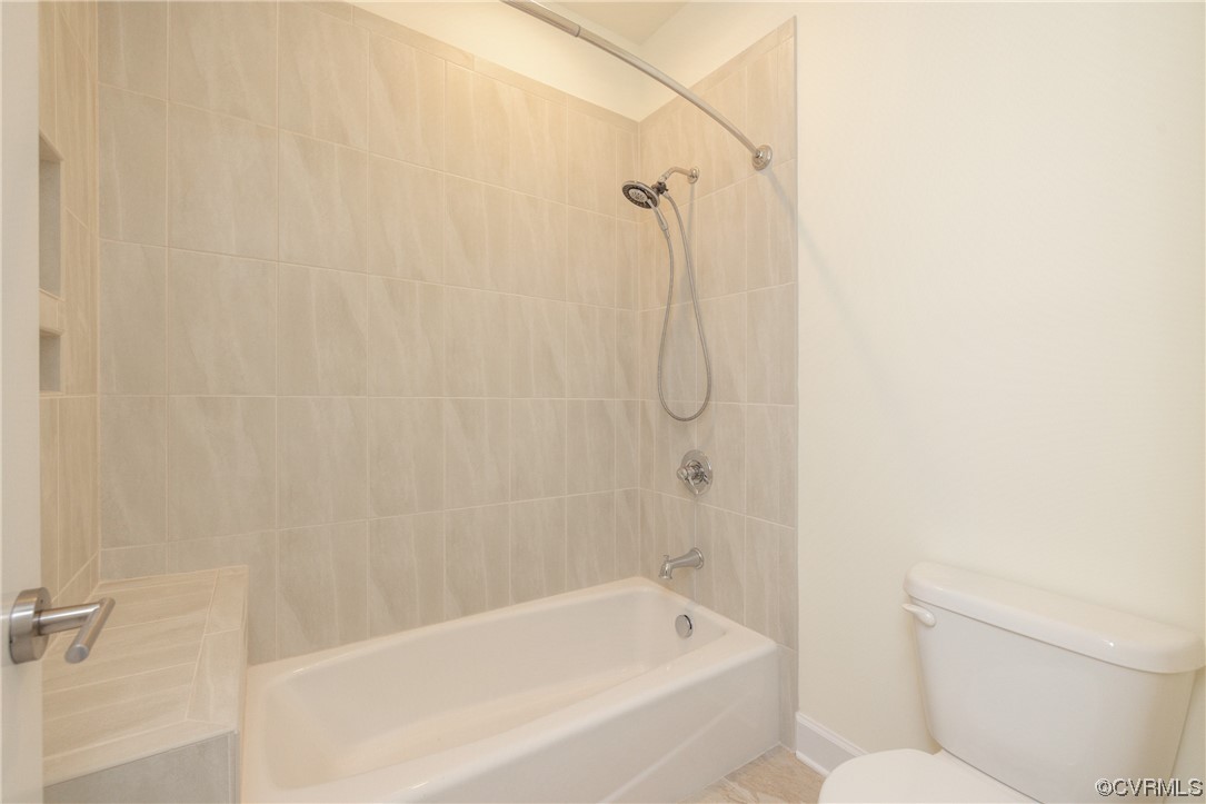 Tiled tub / shower in upstairs bathroom