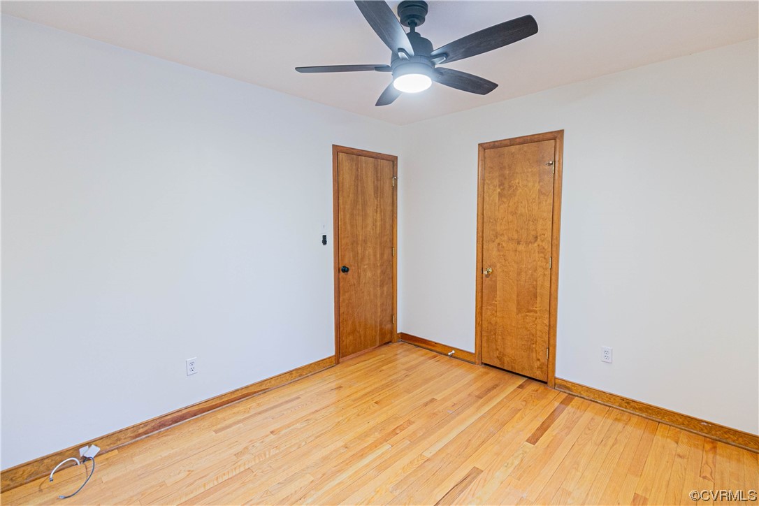 Bedroom 2 featuring light hardwood / wood-style floors and ceiling fan