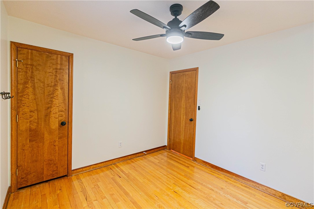 Bedroom 3 featuring light hardwood flooring and ceiling fan
