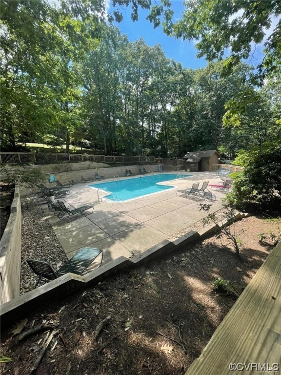 View of swimming pool featuring a patio