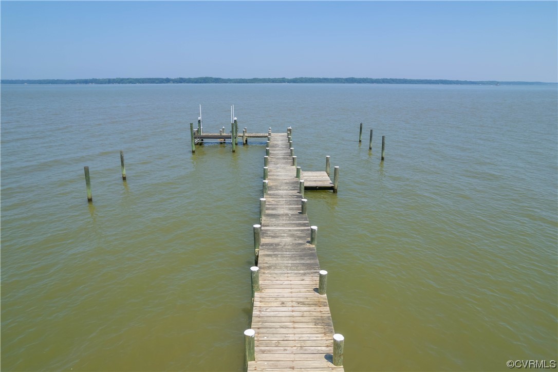 Dock area featuring a water view