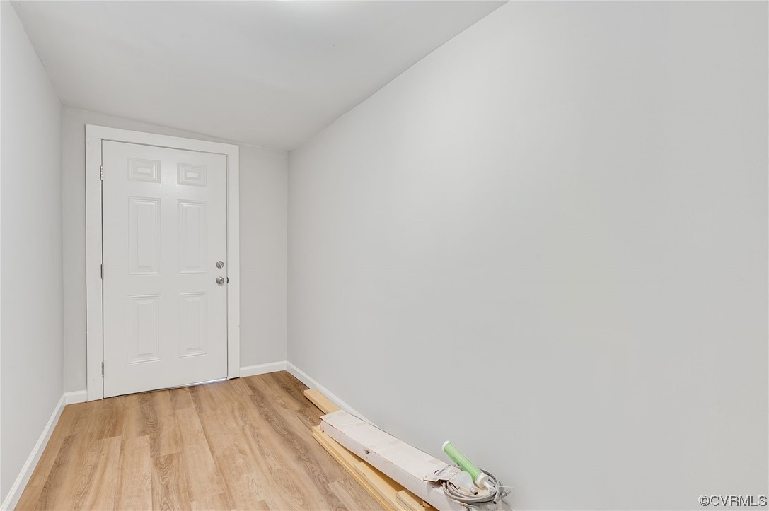 Entryway with light hardwood / wood-style floors
