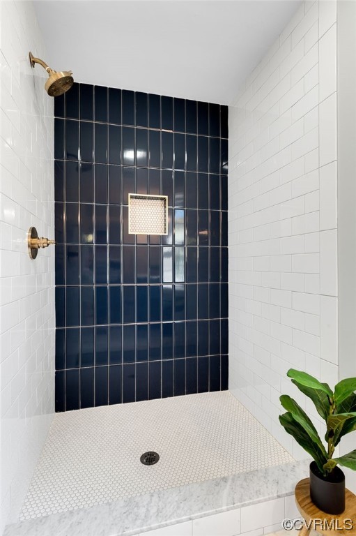 Bathroom with tiled shower, frameless glass